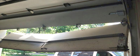 brokengaragedoor Broen out tracks garage door repair